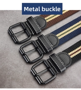Detailed close-up of three striped canvas belts featuring matte black metal buckles