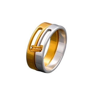 Detailed close-up of a two-tone stainless steel layered ring with polished gold and silver bands