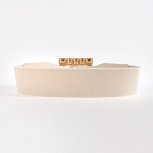 Detail view of a creamy white elastic wide waist belt with a golden square metal buckle