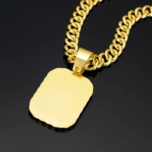 Iced-out gold Cuban link chain with a textured military dog tag pendant for men