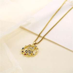 Golden stainless steel necklace with bear pendant and zircon inlay on soft background