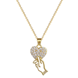 Gold titanium steel necklace with sparkling heart pendant and finger heart gesture charm