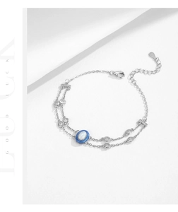 Detail of S925 sterling silver double-layer bracelet with opal stone and sparkling zircon