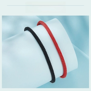Detail of adjustable woven cord bracelets in black and red with S925 silver clasp