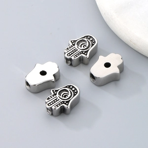 Silver Hamsa hand spacer beads with Fatima palm pattern and smooth metal finish for DIY jewelry