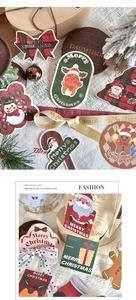 Detailed close-up of cartoon Christmas gift tags and cards with reindeer and snowman shapes
