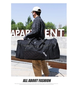 Outdoor shot of a black oxford fabric travel bag with diamond stitching and sports logo