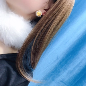Sunflower freshwater pearl earrings with zircon petals on model for elegant style