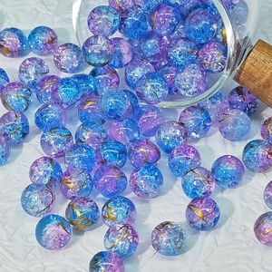 10mm blue and purple cracked glass beads with gold wire detail spilling from glass jar