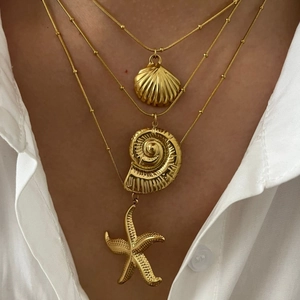 Three-layer gold stainless steel necklace with seashell, conch and starfish ocean pendants
