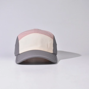 Close-up of a 5-panel baseball cap with pink, cream, and gray color blocking