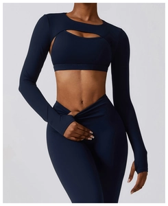 Detail view of dark blue yoga top with hollow design and high-waist fitness leggings