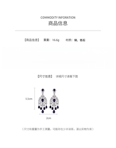 Detail of silver drop earrings with purple zirconia stones and tassel design