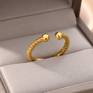 Detailed macro view of 18k gold plated stainless steel twisted rope ring with twin beads