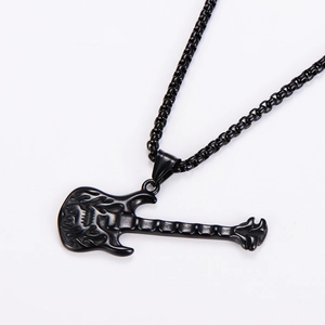 Detailed view of the black retro guitar pendant necklace with embossed textures