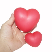 Close-up detail of two red heart-shaped squishy stress relief toys for kids and gifts