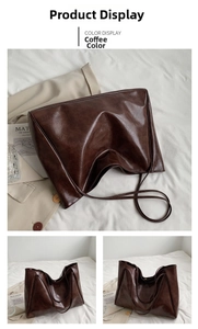 Detail view of large coffee brown tote bag with oily texture and slim double straps