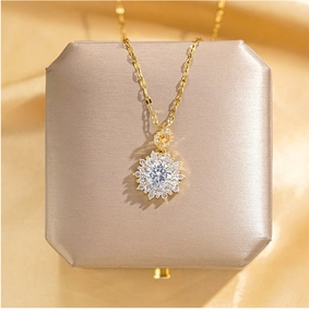 Detailed macro view of gold plated sunflower necklace with sparkling zircon pavé setting