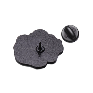 Detailed back view of cartoon duck enamel pin showing metal base and rubber clutch