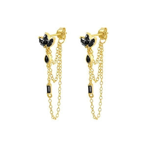 Macro detail of gold tassel earrings with black marquise and rectangular gemstones