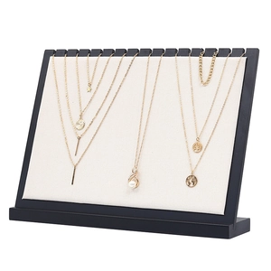 Solid wood necklace display stand with beige fabric inserts for jewelry counter display