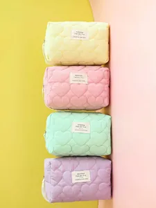 High-capacity quilted heart pattern makeup bags in yellow, pink, green, and purple colors