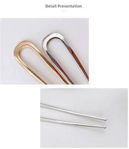 Detailed macro view of U-shaped metal hairpins in polished gold and silver finishes
