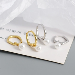 S925 silver retro geometric pearl drop earrings in gold and silver finish on display