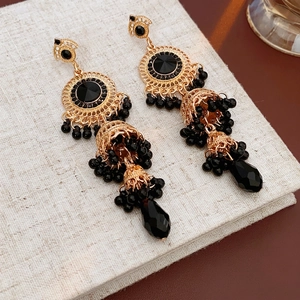 Vintage gold-tone chandelier earrings with black rhinestones and water drop crystals