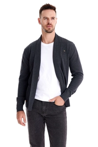 Detail of dark grey knit cardigan paired with a white t-shirt and casual jeans