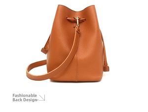 Rear view of brown litchi pattern leather bucket bag with drawstring and gold hardware