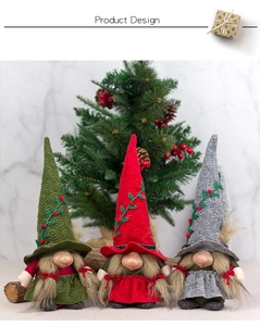 Detailed view of three Christmas gnomes with spiral-textured caps and red berry accents