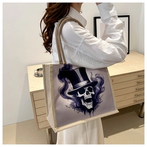 Canvas tote bag with gothic skull print shown on model in minimalist indoor setting