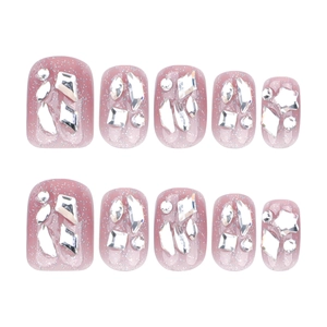 Sparkly pink press-on nails with silver glitter and assorted luxury rhinestones in 10-piece set
