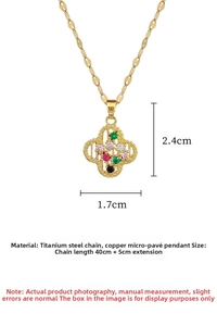 Macro detail of gold titanium steel necklace featuring a colorful clover zircon pendant
