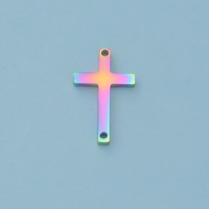 Macro view of rainbow stainless steel double-hole cross pendant with mirror finish