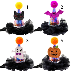 Detail view of four Halloween pet party hats with bat, pumpkin, and ghost designs