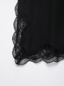 Detalle de encaje negro bordado de alta calidad y dobladillo festoneado elegante