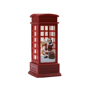 Red Christmas telephone booth decoration with Santa Claus figure for holiday tabletop decor