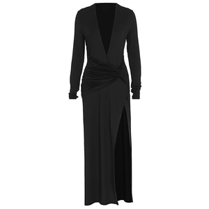 Detail of the high side slit and elegant side ruching on a black deep V-neck dress