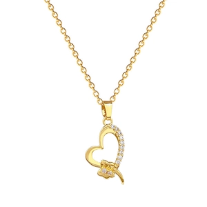 Titanium steel gold necklace with heart bow pendant and crystals on white background