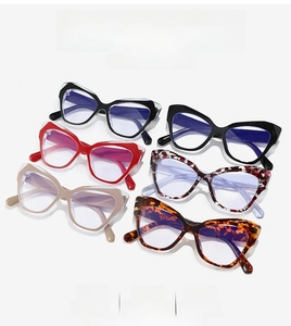 Flat lay of trendy cat eye glasses in diverse colors with blue light blocking lenses