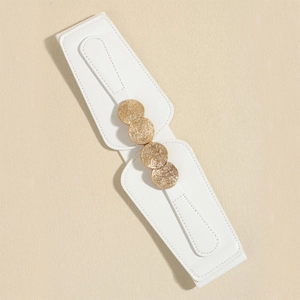 Detail of white elastic waist belt with four textured gold round buckles on beige background