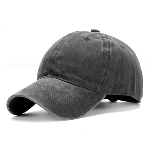 Detail view of washed charcoal grey baseball cap with vintage distressed cotton fabric