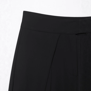 Women's black casual loose pleated trousers featuring waistband and fly stitching detail
