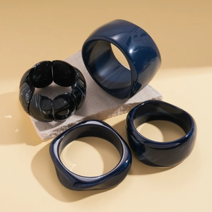 Irregular geometric resin bangle set with navy blue bracelets and marble pattern beads