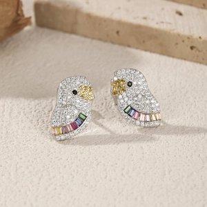 S925 Sterling silver parrot earrings with colorful crystals on a beige background