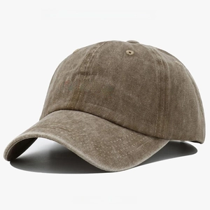 Close-up of red CHANCE embroidery on a vintage washed khaki cotton baseball cap