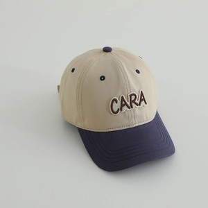 Detailed close-up of contrasting color baseball cap with 3D CARA embroidery on front