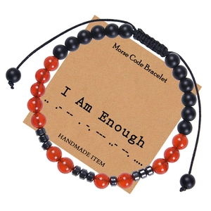 Detail of Morse Code Bracelet with red agate and matte beads on I Am Enough card